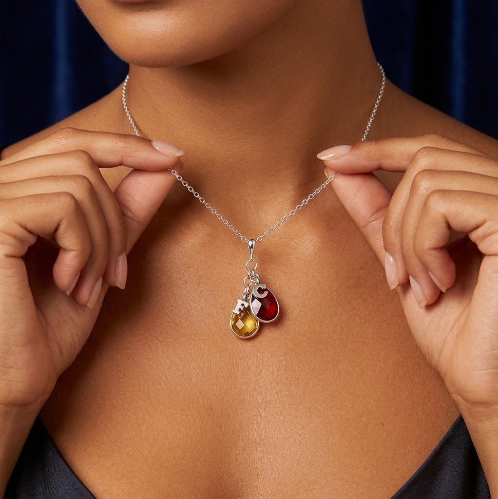 Woman wearing sterling silver family tree birthstone necklace
