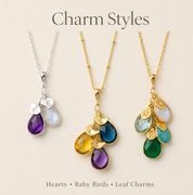 Charm style options for personalized birthstone necklace, showing leaf, bird, and heart initial charms for custom family jewelry.