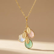A gold birthstone necklace with engraved name tags. Stones are bezel set and placed on a cable link chain. Birthstone necklace, mother's necklace, Christmas, Mother's Day gift for mom from kids, birthstone kids necklace, new mom necklace