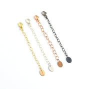 Set of necklace extenders in gold, silver, and rose gold with lobster clasps, ideal for layering or adjusting necklace length. Adjustable chain extension adds versatility to jewelry collection, ensuring a comfortable fit for every outfit. Jewelry accessory gift idea for birthdays, bridesmaids, or everyday wear.