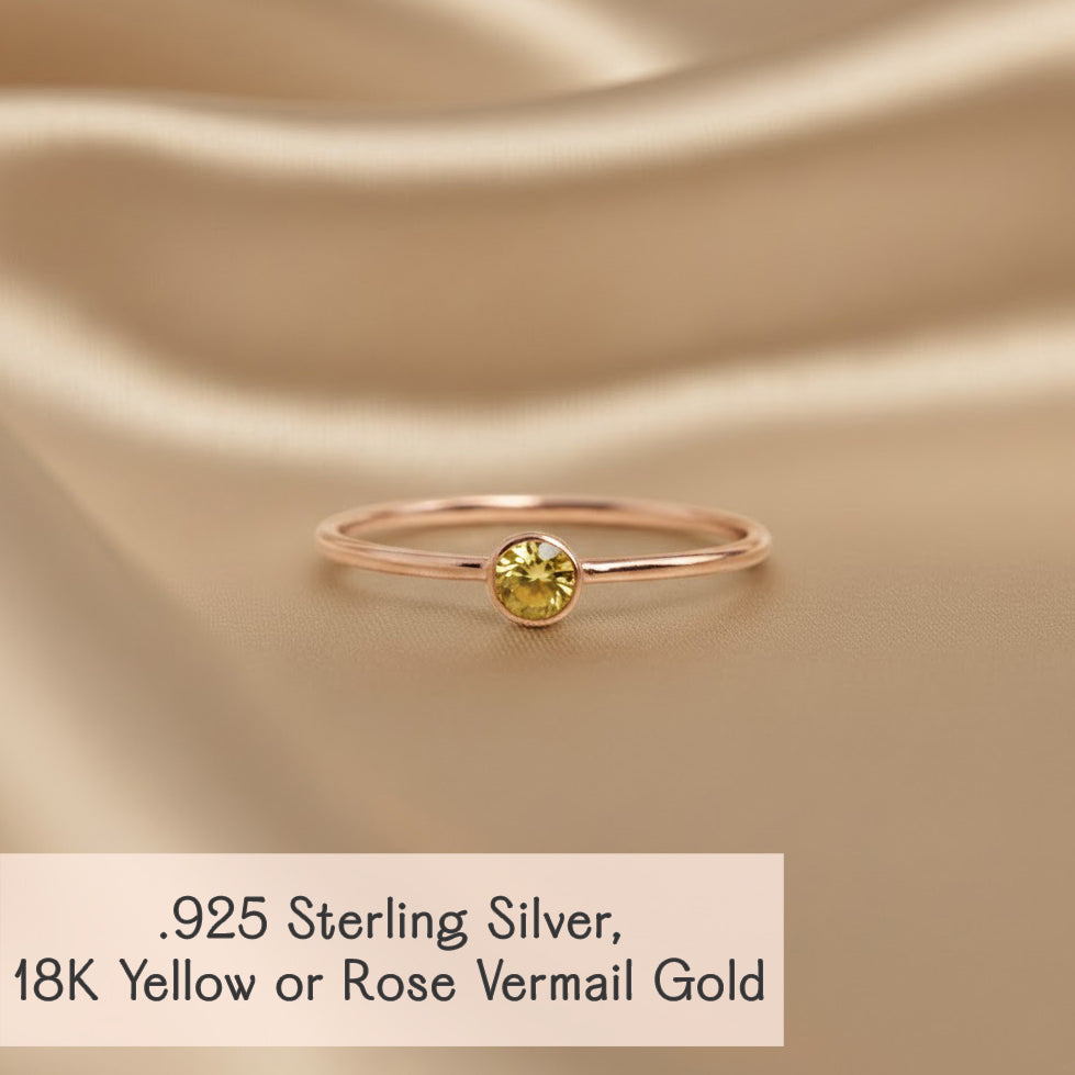 Rose-gold tone minimalist citrine ring on satin, 925 sterling base with 18K vermeil, petite bezel stone for stacking sets.