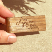 Close-up of cherry wood money clip engraved with handwriting for a sentimental, personal touch. Perfect for memorial gifts, anniversaries, and milestone celebrations. Crafted from solid wood and laser engraved for sharp detail, this slim, minimalist design keeps bills secure while adding a meaningful element to his everyday carry.