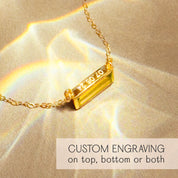 close-up of citrine baguette birthstone bar necklace showing optional personalized engraving area along the vertical pendant, natural golden citrine gemstone set in 18k gold filled frame, delicate chain reflecting subtle light, custom engraved November birthstone necklace ideal for gifting occasions like birthday, graduation or Christmas, modern minimalist jewelry piece crafted for everyday wear and layering