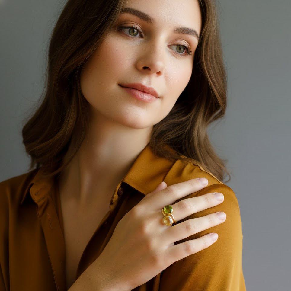 Model in golden is wearing gold plated over Sterling silver stacking ring set in citrine and peridot birthstones. Citrine ring, November birthstone jewelry, Light yellow gemstone ring, Oval faceted, Bezel set ring, 18k vermeil gold, Sterling silver ring, Citrine gift, November birthday gift, ring for her, august birthstone, august gemstone, green gem, green birthstone