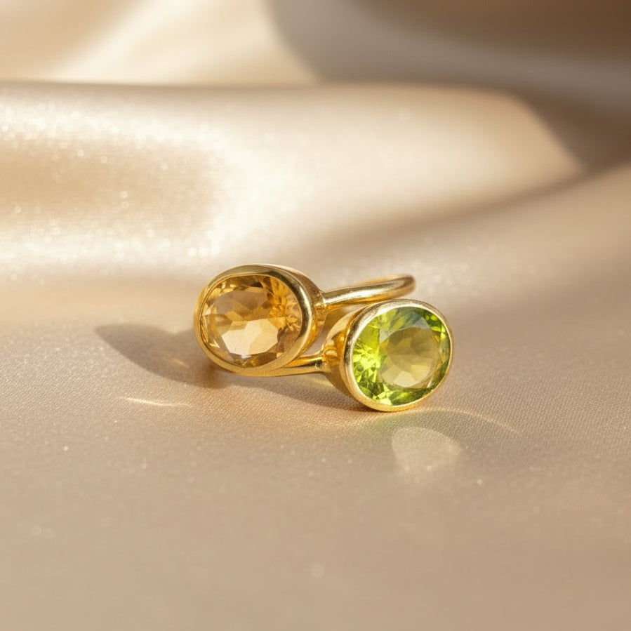 Citrine and peridot two-stone ring in gold, featuring faceted yellow and green gemstones symbolizing November and August birthstones, handcrafted bezel-set design, personalized birthstone jewelry gift for her.