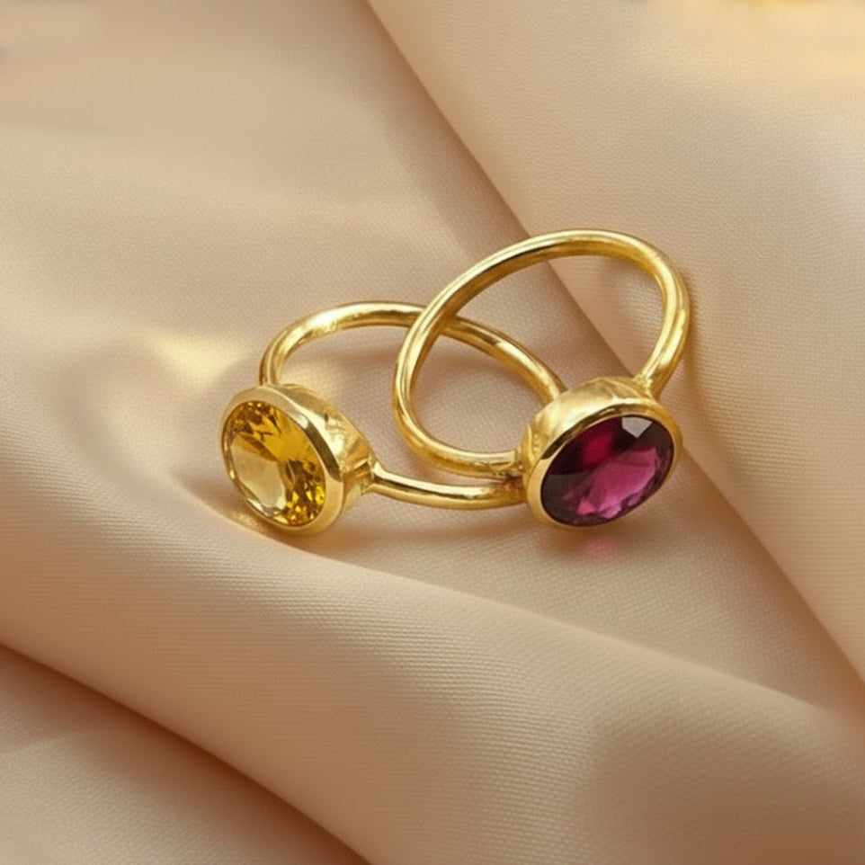 Gold birthstone rings featuring citrine and garnet oval gemstones, handcrafted jewelry for November and January birthdays, stackable minimalist rings for her or bridesmaid gifts.