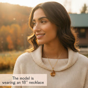 Woman wearing citrine birthstone pendant necklace layered-style, golden-yellow gemstone drop on an 18-inch chain, personalized November birthday jewelry gift for women.