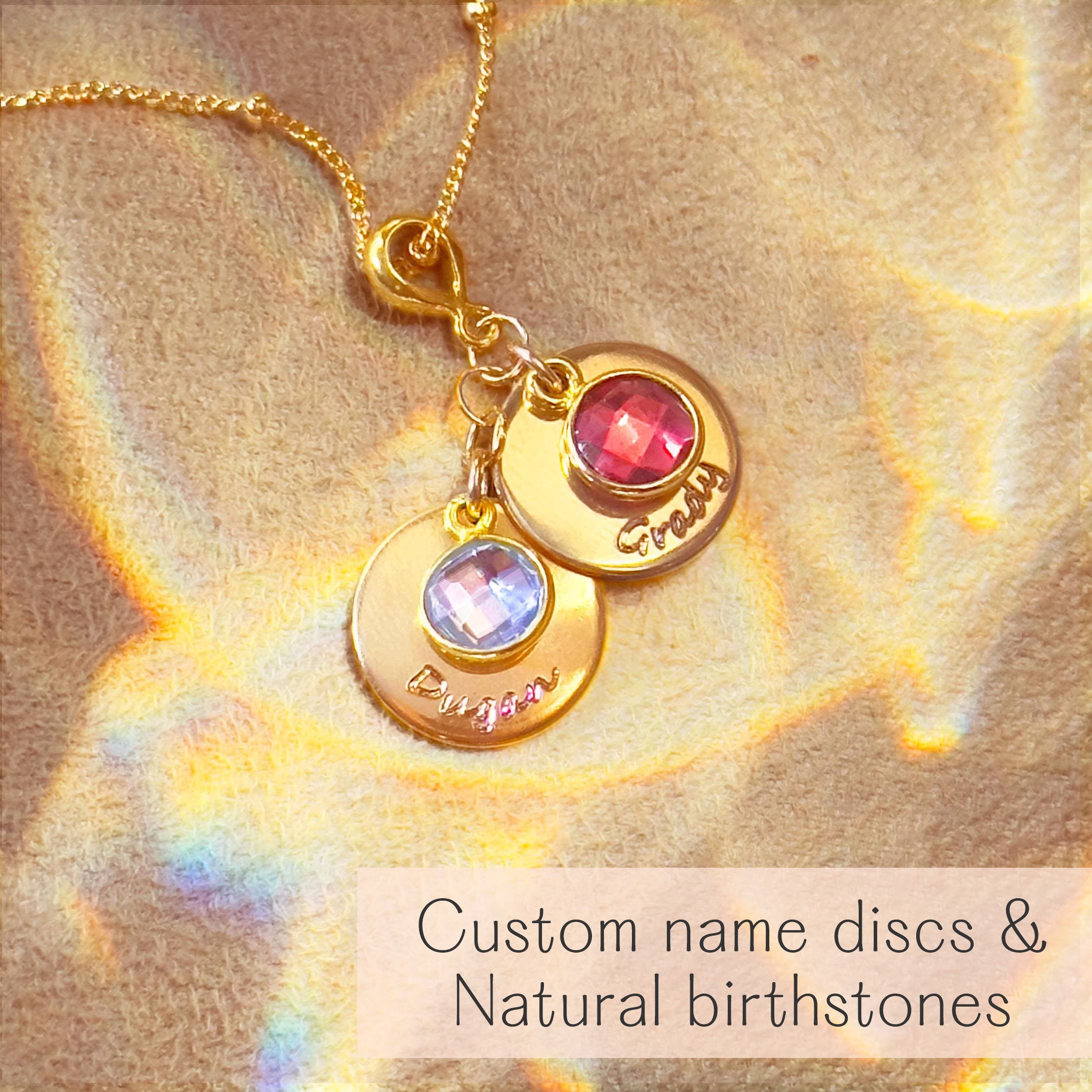 Close-up of a gold personalized mom or grandmother necklace with birthstone charm, showcasing detailed engraving, vibrant colors, and luxe finish. A stylish, durable keepsake for new grandma gifts or meaningful family jewelry.