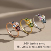 customized three stone birthstone rings displayed in sterling silver, gold vermeil and rose gold vermeil, each band featuring a trio of colorful gemstones chosen to represent family members or children, dainty mothers ring ideal for personalized family jewelry gifts, modern minimalist cluster design suitable for stacking or everyday wear, meaningful Mother’s Day or birthday keepsake handcrafted with high-quality materials
