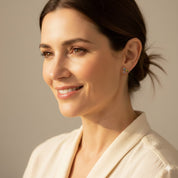 Woman wearing cluster birthstone bar stud earrings with a natural, minimalist look, featuring bezel-set gemstones in gold vermeil or sterling silver. Elegant personalized jewelry perfect for Mother’s Day, birthdays, bridesmaids, or everyday wear. Dainty birthstone studs with bright gemstone colors offering meaningful, custom gifting options for women who love delicate accessories.