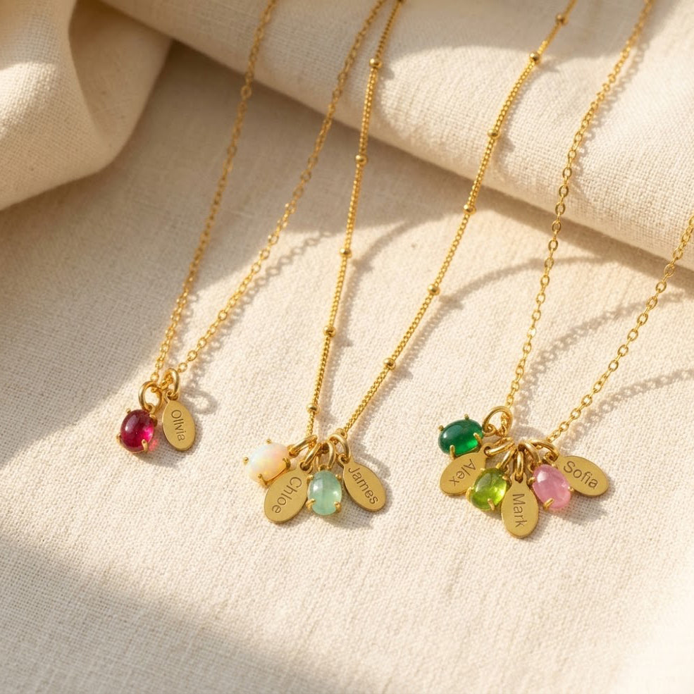 Custom Mom birthstone necklaces shown with different colorful gemstones and engraved name charms.
