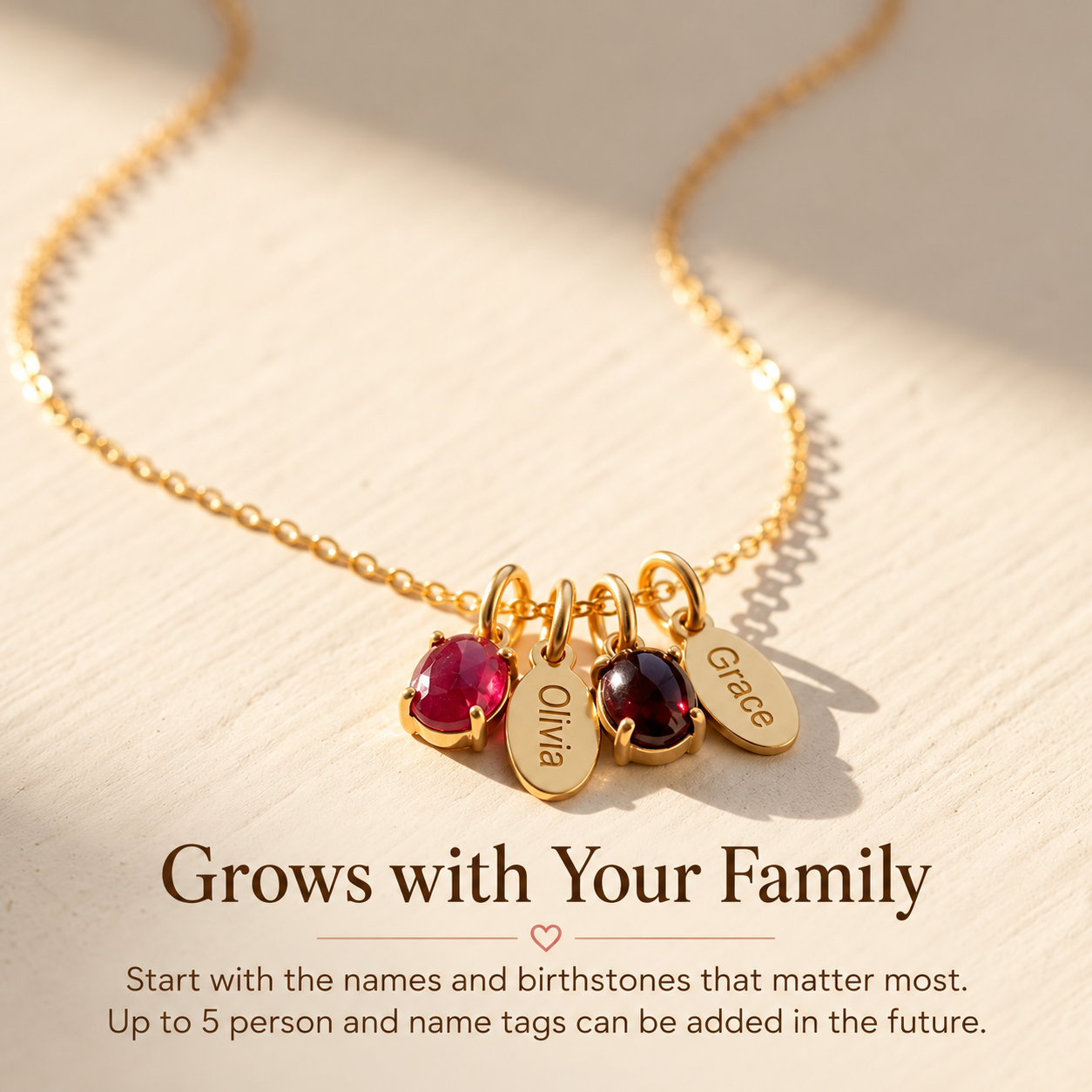 Personalized family birthstone necklace with kids name charms showing additional charms can be added later.
