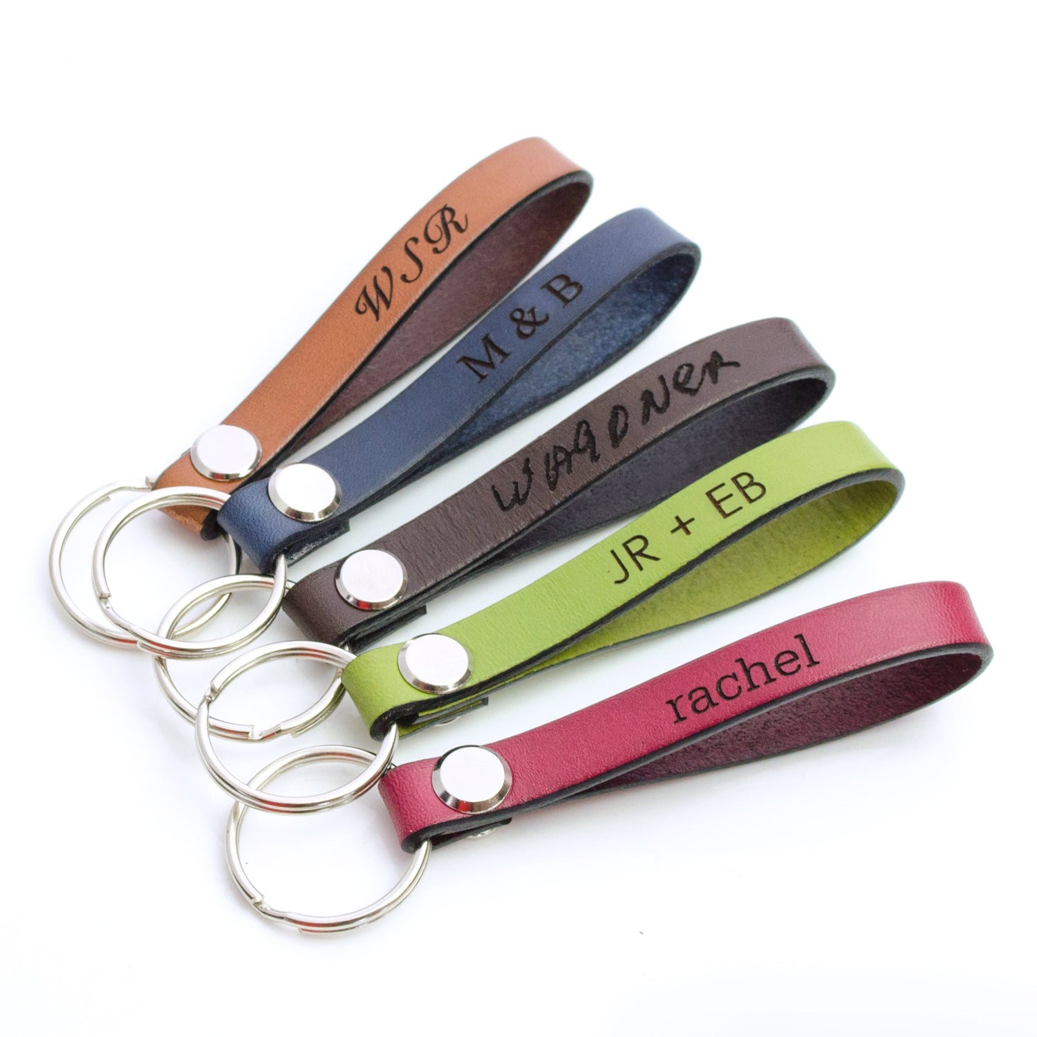 Bright and colorful leather keychains with silver ring engraved with initials, handwriting, or name.