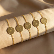 Aquarius and Pisces constellation bracelet styled on wrist, modern minimalist zodiac sign jewelry