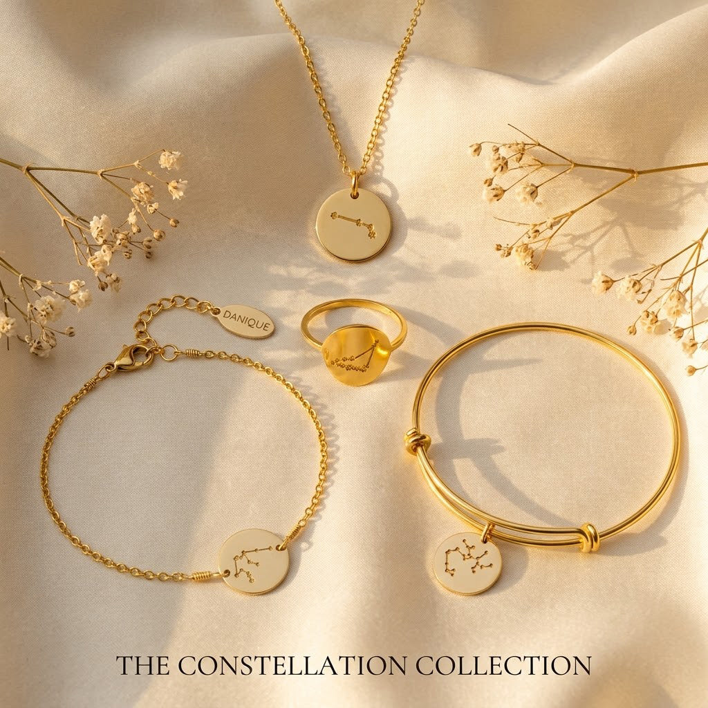 Matching constellation jewelry set with necklace, bracelet, and ring in yellow gold finish.