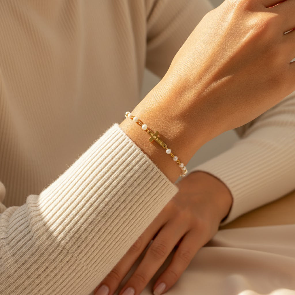 Sterling silver personalized cross bracelet with hand-engraved name and date; minimalist faith accessory for everyday wear or special occasions.