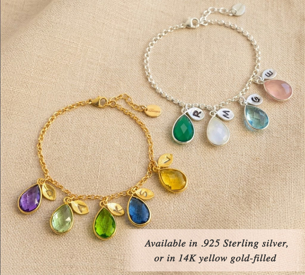 Gold and silver custom birthstone and initial charm bracelets flat lay, personalized family bracelets for mom