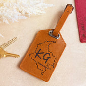 Custom engraved brown leather luggage tag with family name and established date. Sturdy strap and durable buckle ensure security for years of travel. Personalized travel accessory that makes a meaningful gift for newlyweds, anniversaries, or family vacations.