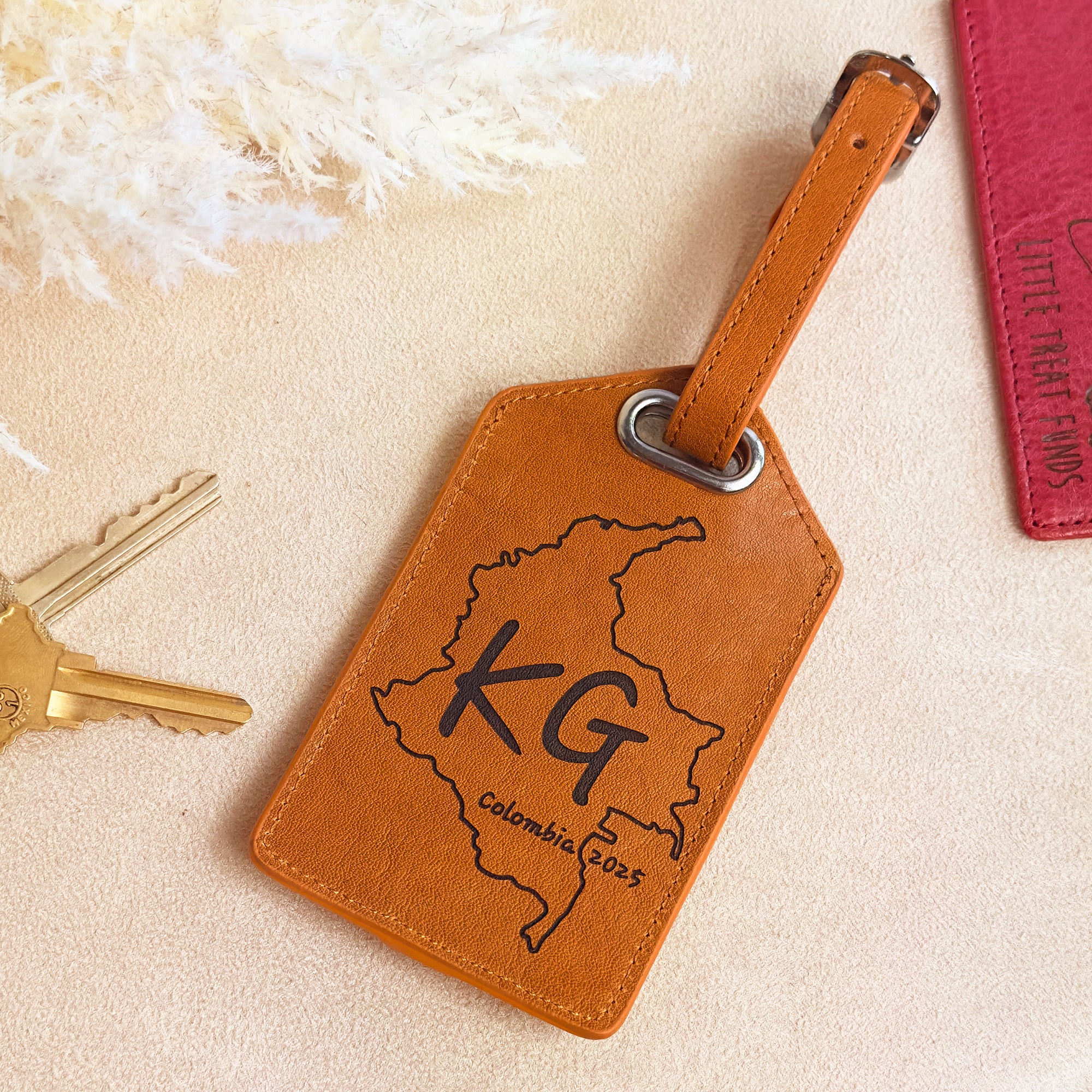 Custom engraved brown leather luggage tag with family name and established date. Sturdy strap and durable buckle ensure security for years of travel. Personalized travel accessory that makes a meaningful gift for newlyweds, anniversaries, or family vacations.