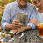 Personalized stainless steel flask held by an older couple, highlighting sentimental engraving and meaningful personalization, custom flask gift for dad or grandfather, engraved hip flask made from durable stainless steel, thoughtful father’s day or retirement gift, classic personalized barware designed to celebrate family, milestones, and lasting memories