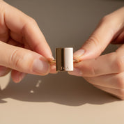 Personalized engraved rectangle ring shown in hands, custom name jewelry with vertical or horizontal alignment option, gold minimalist statement ring