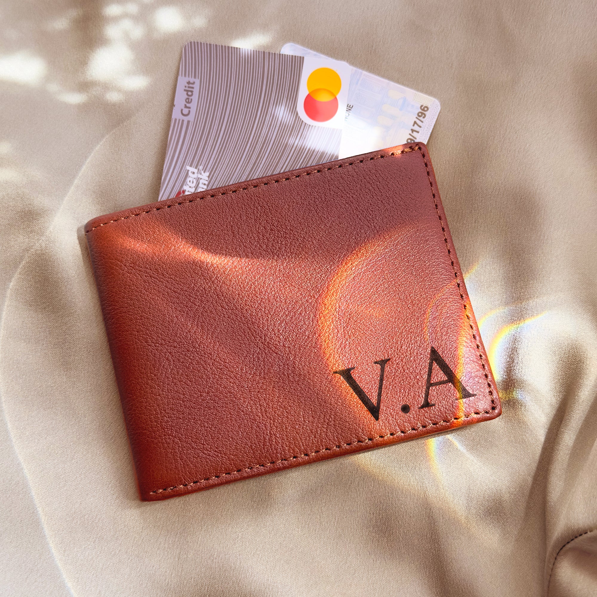 Custom leather wallet for men engraved with initials “V.A.” in a sleek monogram style. Handcrafted personalized wallet with bifold design, cash pocket, card slots, and ID window. Ideal engraved wallet for men, husband, or boyfriend, this custom engraved wallet makes a stylish Father’s Day, birthday, Christmas, or groomsmen gift. A high-quality personalized wallet for him, engraved to last.