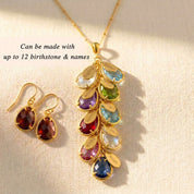Detailed close-up of custom birthstone necklace with engraved name charms and colorful gemstones, personalized jewelry for mom or grandma in gold or sterling silver