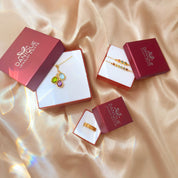 Danique Jewelry gift packaging with custom engraved footprint necklace, gemstone birthstone necklace, bracelet, and gold band ring in signature gift boxes. Perfect presentation for personalized footprint necklace, baby memorial jewelry, or new mom gift. Elegant jewelry gift box makes it ready for giving at baby showers, Mother’s Day, Christmas, birthdays, or anniversaries. High-quality packaging adds a special finishing touch, making your keepsake jewelry even more meaningful for mothers, grandmothers, or l
