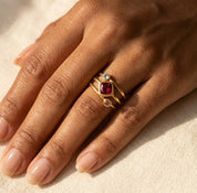 Woman wearing a custom birthstone ring set with colorful gemstones, designed as meaningful mom jewelry with stones for children or loved ones.