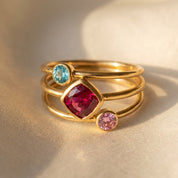 Mom and kids birthstone ring set with three teardrop gemstone rings in yellow gold, personalized family jewelry for mothers with children’s birthstones.