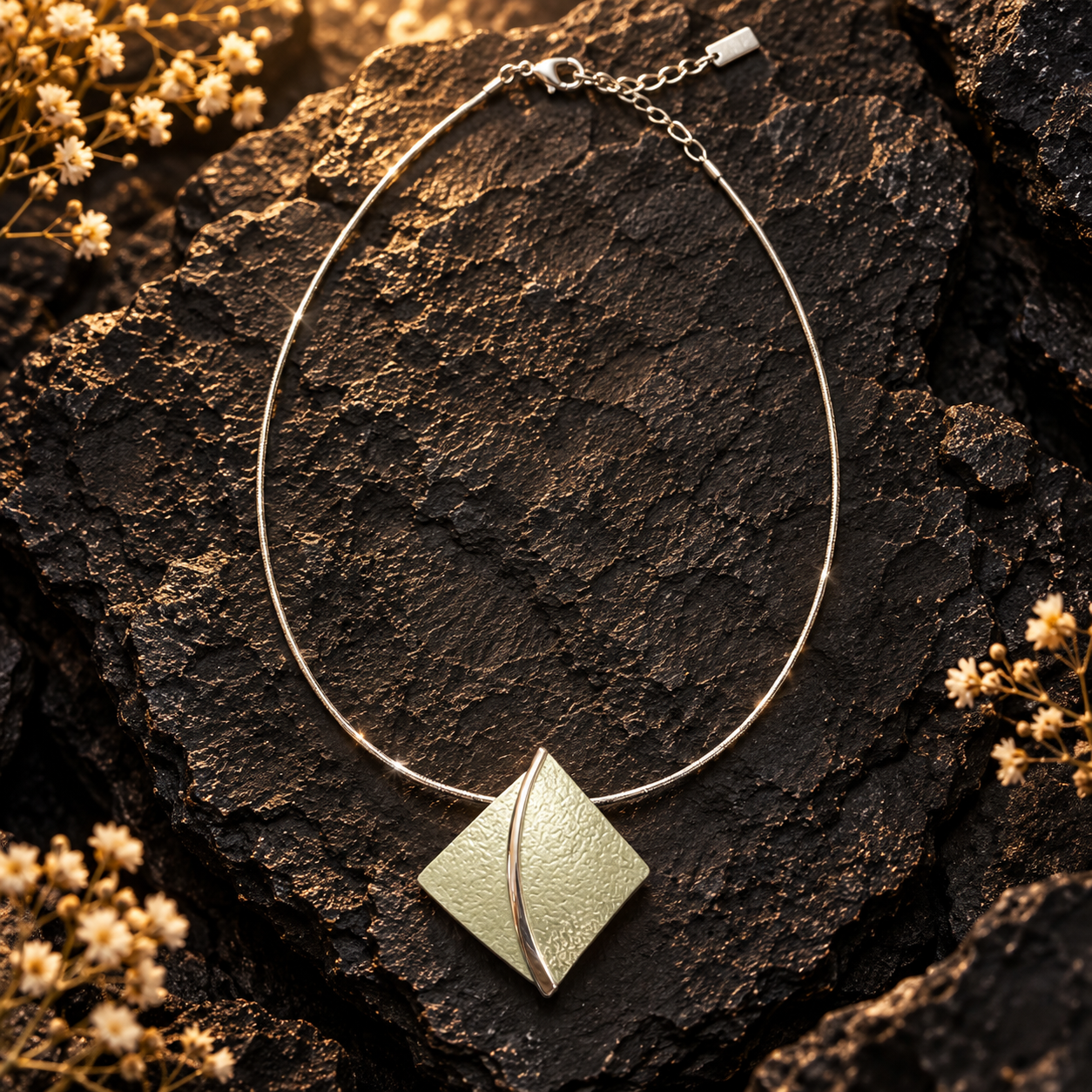
Full Soft Pearl sculpted leaf pendant necklace displayed on dark textured stone

