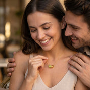 Woman wearing a two birthstone necklace as meaningful couple jewelry with two personalized gemstone choices.