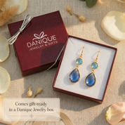 Blue gemstone double drop earrings presented in a Danique Jewelry gift box ready for gifting.