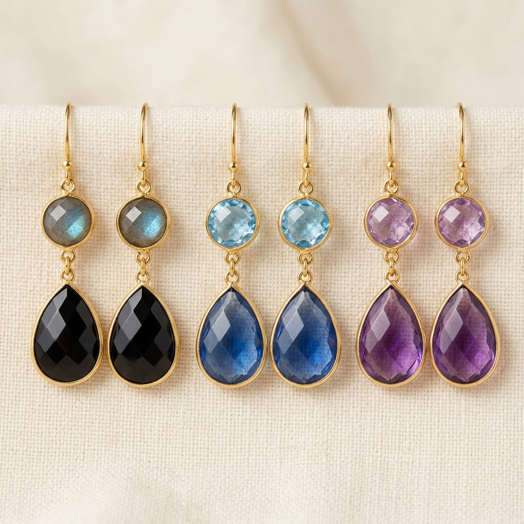 Custom double drop birthstone earrings with round and teardrop gemstones in labradorite, blue topaz, and amethyst.