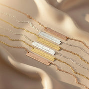 Multiple engraved inspirational bar necklaces on a white background. Engraved bar pendant for special memories Personalized bar necklace with unique touch Custom bar necklace for meaningful gifts Engraved minimalist bar necklace for bridesmaids Personalized bar pendant with custom engraving Custom bar necklace for special memories Engraved bar necklace for her unique style Personalized minimalist bar pendant with name Custom bar necklace for friends and family
