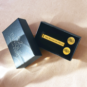 Personalized engraved tie bar and cufflinks set in gold with monogram initials and engraved message, displayed in Danique gift box. Available in silver, gold, or black, with round or square cufflinks. Perfect as a groomsmen gift, groom gift, or Father of the Groom keepsake. A timeless personalized men’s accessory, gift-ready for weddings, anniversaries, promotions, and Christmas.
