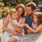 Family of four representing a meaningful two birthstone gift for Mom
