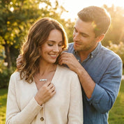 Couple sharing a meaningful moment wearing a personalized fingerprint bar necklace, sentimental jewelry gift symbolizing love and connection, custom engraved bar necklace for couples or anniversaries