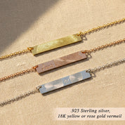 Personalized fingerprint bar necklaces displayed in three metal finishes, featuring custom engraved fingerprint designs on horizontal bar pendants in 925 sterling silver, 18K yellow gold vermeil, and 18K rose gold vermeil, shown on a neutral linen background with delicate chains, minimalist memorial and sentimental jewelry design, custom keepsake necklace gift for couples, family, or loved ones, handcrafted fine jewelry with meaningful engraving options.