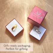Fingerprint engraved rings in gold and silver displayed inside elegant red Danique Jewelry gift boxes, highlighting premium gift-ready packaging. These personalized fingerprint bands make meaningful keepsakes for weddings, anniversaries, or memorial jewelry, and arrive beautifully boxed for easy gifting. Perfect as his and hers rings, couple promise rings, or sympathy gifts, each piece is handcrafted in sterling silver, gold, or rose gold and delivered in a signature jewelry box.