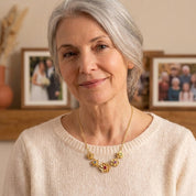 grandmother wearing custom family birthstone necklace close up
