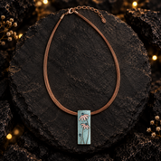 Full boho rectangular flower pendant necklace displayed on dark textured background