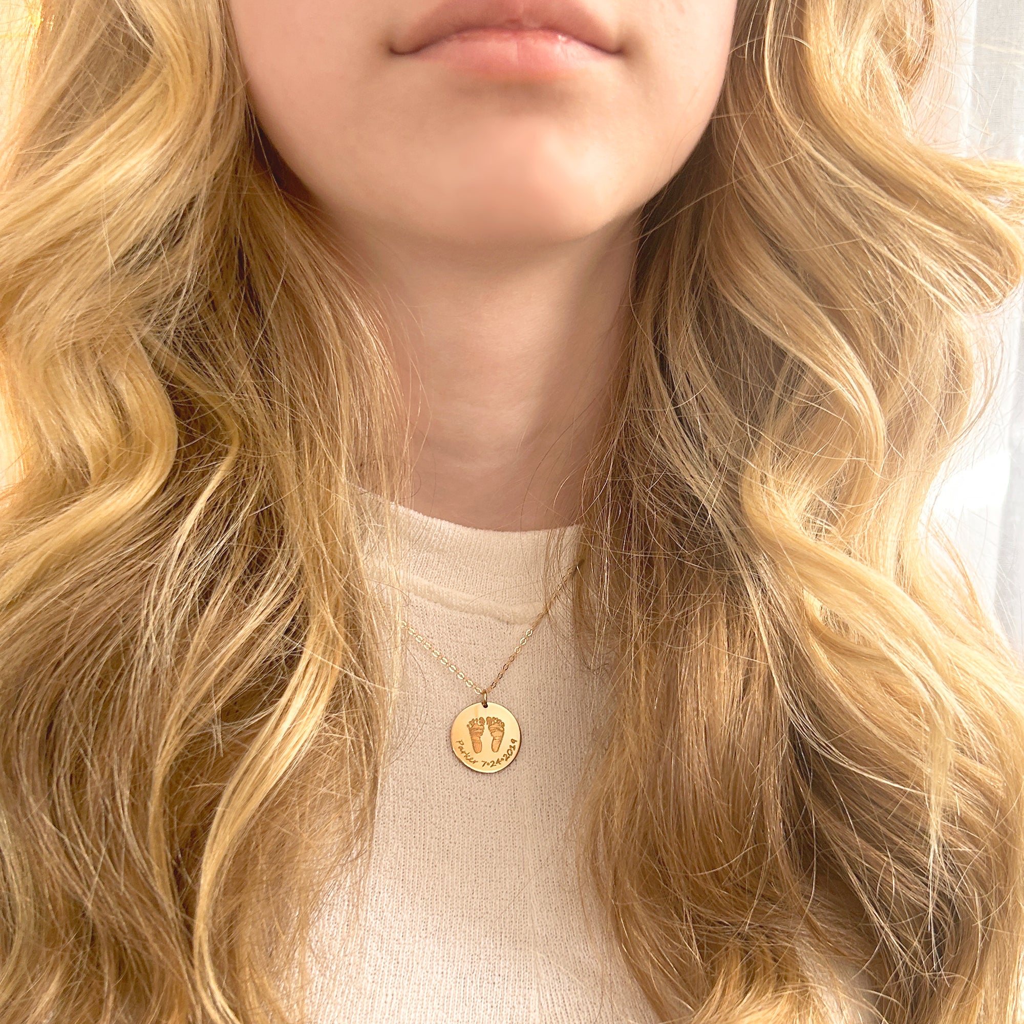 A model wearing a gold engraved footprint necklace. mother bereavement gift, grieving mom gift, sympathy gift, remembrance gift, keepsake, lasting connections jewelry, mothers day gift