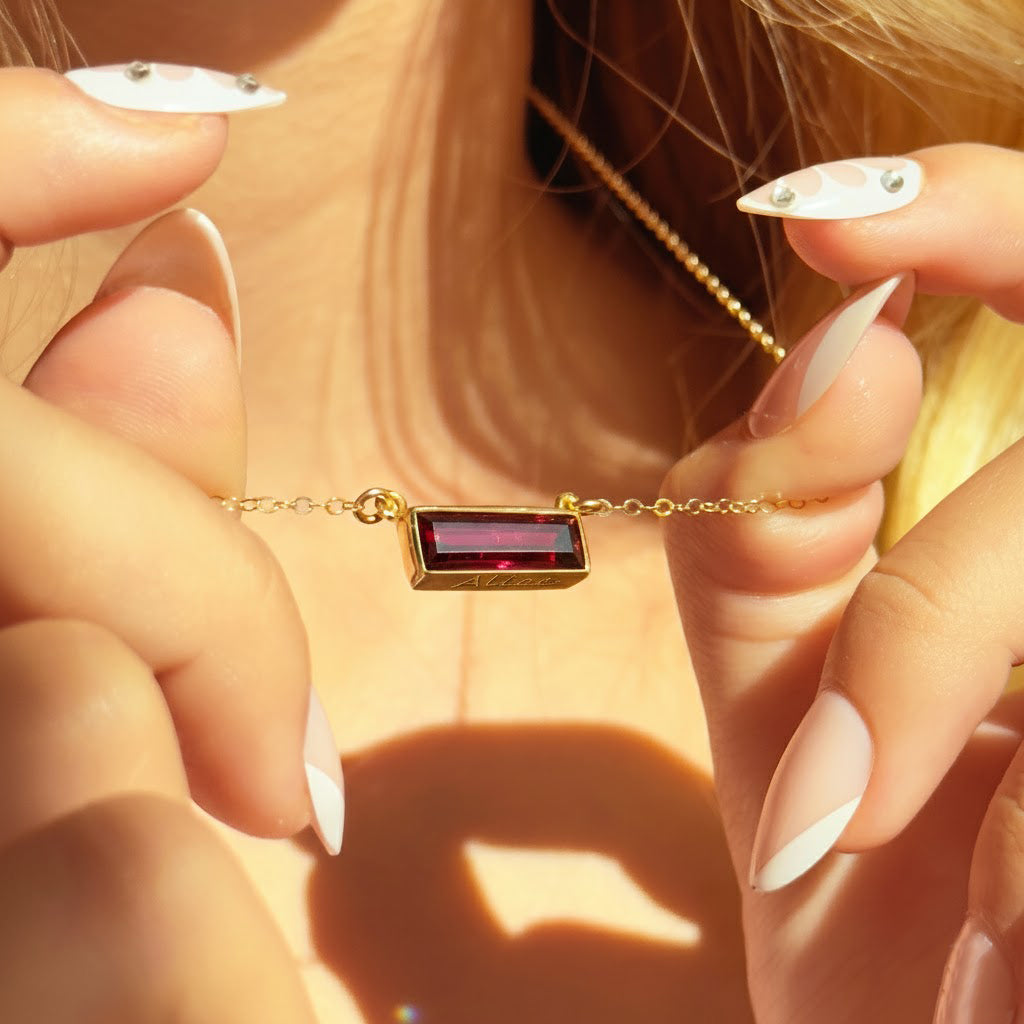 Single gold filled cable chain horizontal garnet quartz january birthstone adira bar necklace with bottom engraved secret message on white background, gemstone adira bar connectors. birthstone jewelry, birth month jewelry, birthstone necklace, jewelry gift, necklace gift for her, anniversary gift, christmas gift, valentine's day gift, wedding jewelry, bridesmaid's jewelry, gift for mom, gift for wife, gift for girlfriend, gift for grandma, mother's day gift
