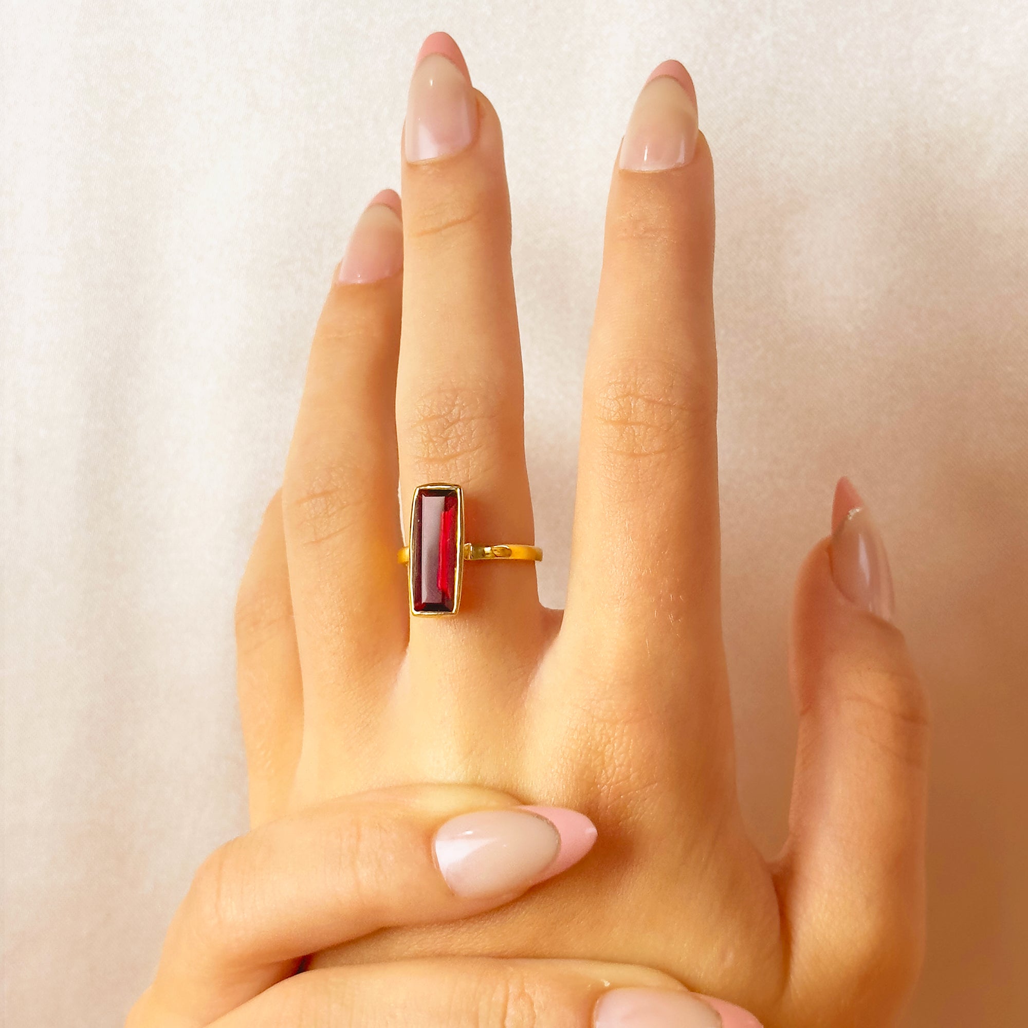 garnet-january-birthstone-baguette-adira-ring-model.jpg
