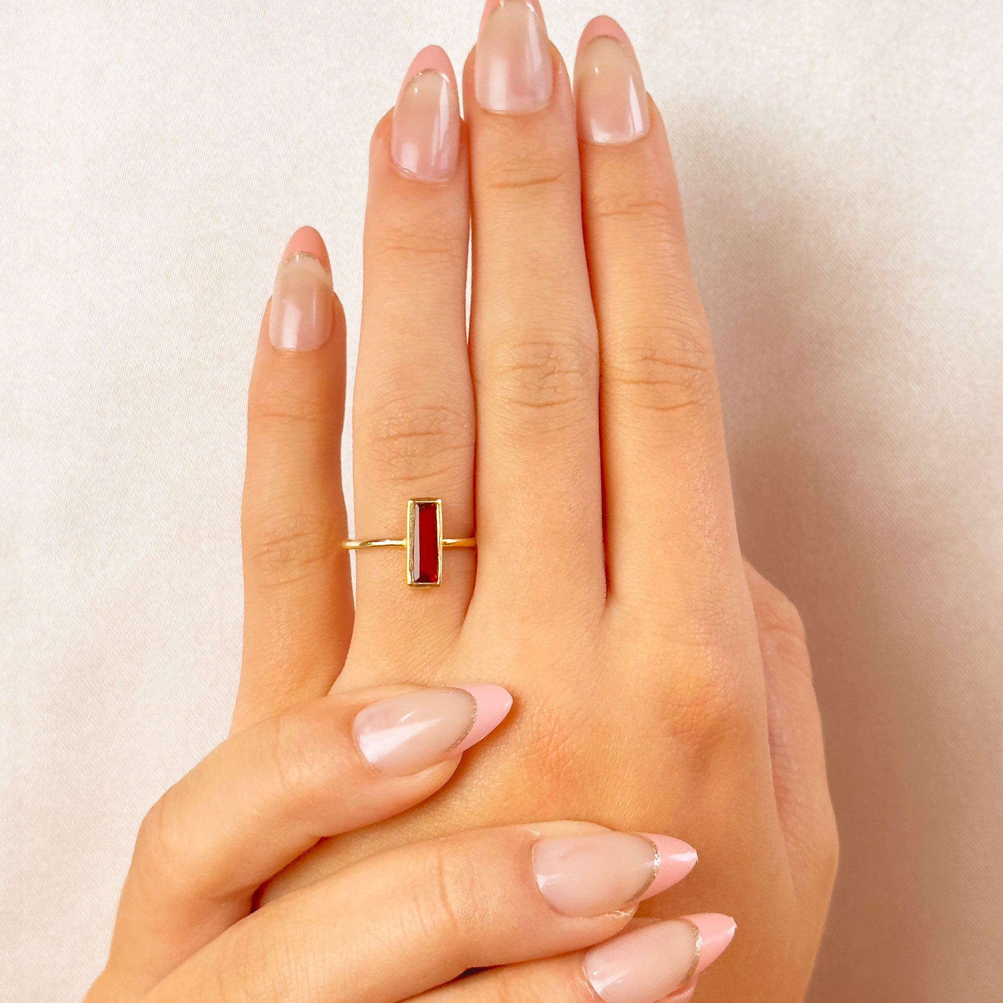garnet-january-birthstone-small-baguette-adira-ring-model.jpg