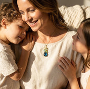Mother wearing a custom birthstone necklace with her children, a personalized family necklace designed with birthstones for mom, grandma, or loved ones.