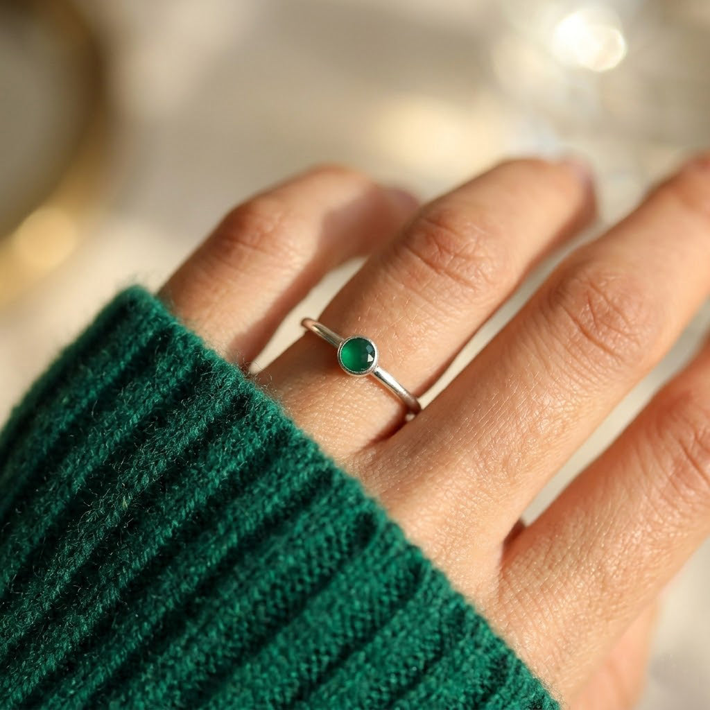 on hand emerald onyx ring gold minimalist bezel set green gemstone ring
