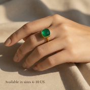 Green onyx cushion cut ring photographed on hand with sizing reference. Available in US ring sizes 4–10, this minimalist May birthstone ring offers a comfortable and flattering fit.