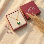 Personalized Green Onyx name necklace displayed in Danique Jewelry signature gift-ready packaging.

